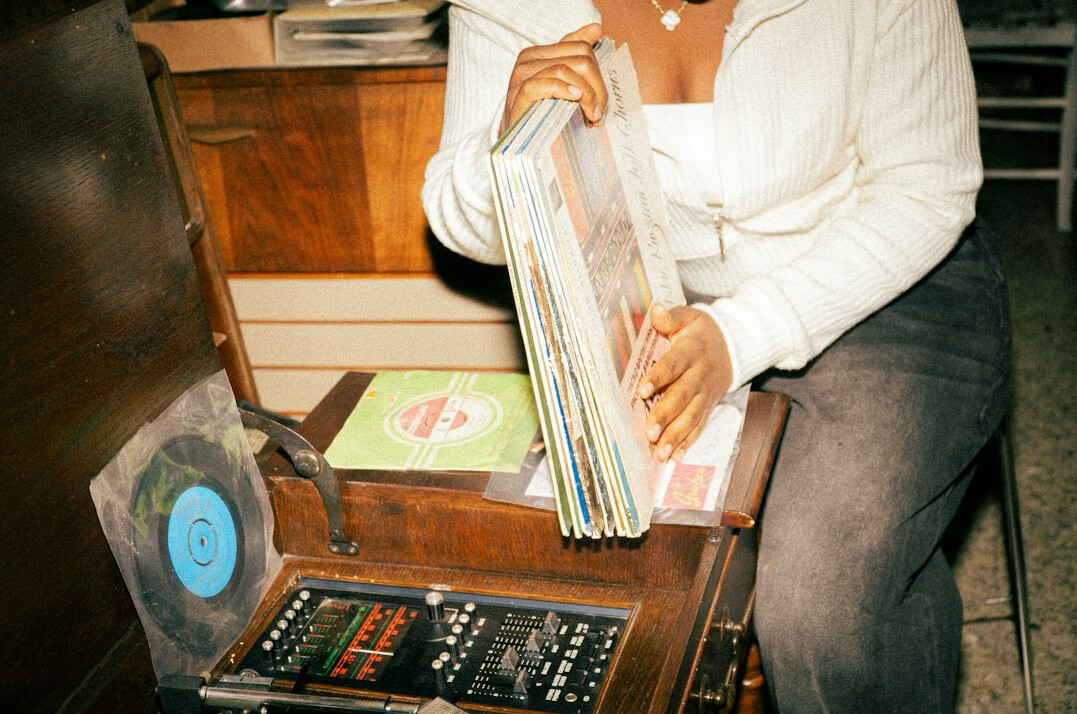 Journalist reviewing printed documents and files on a desk